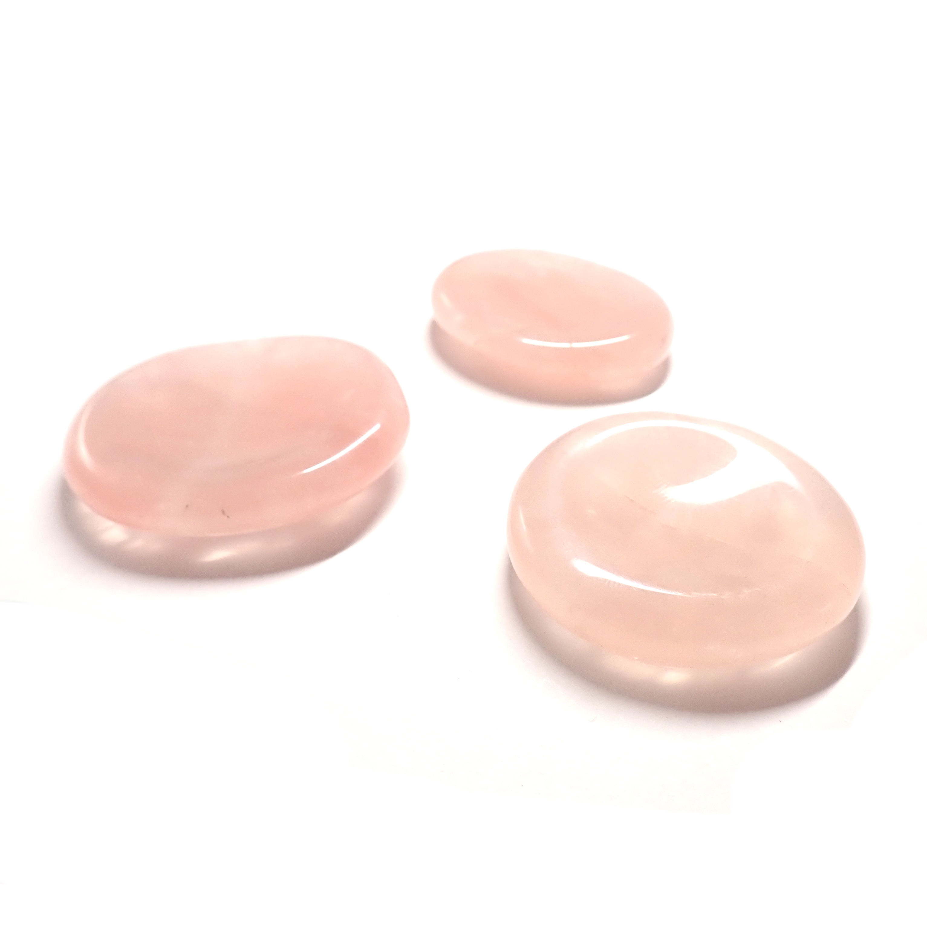 Photo de trois pierres pouce/worry stone en Quartz Rose